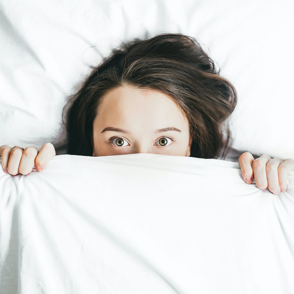 A woman trying to get more sleep to boost her immune system