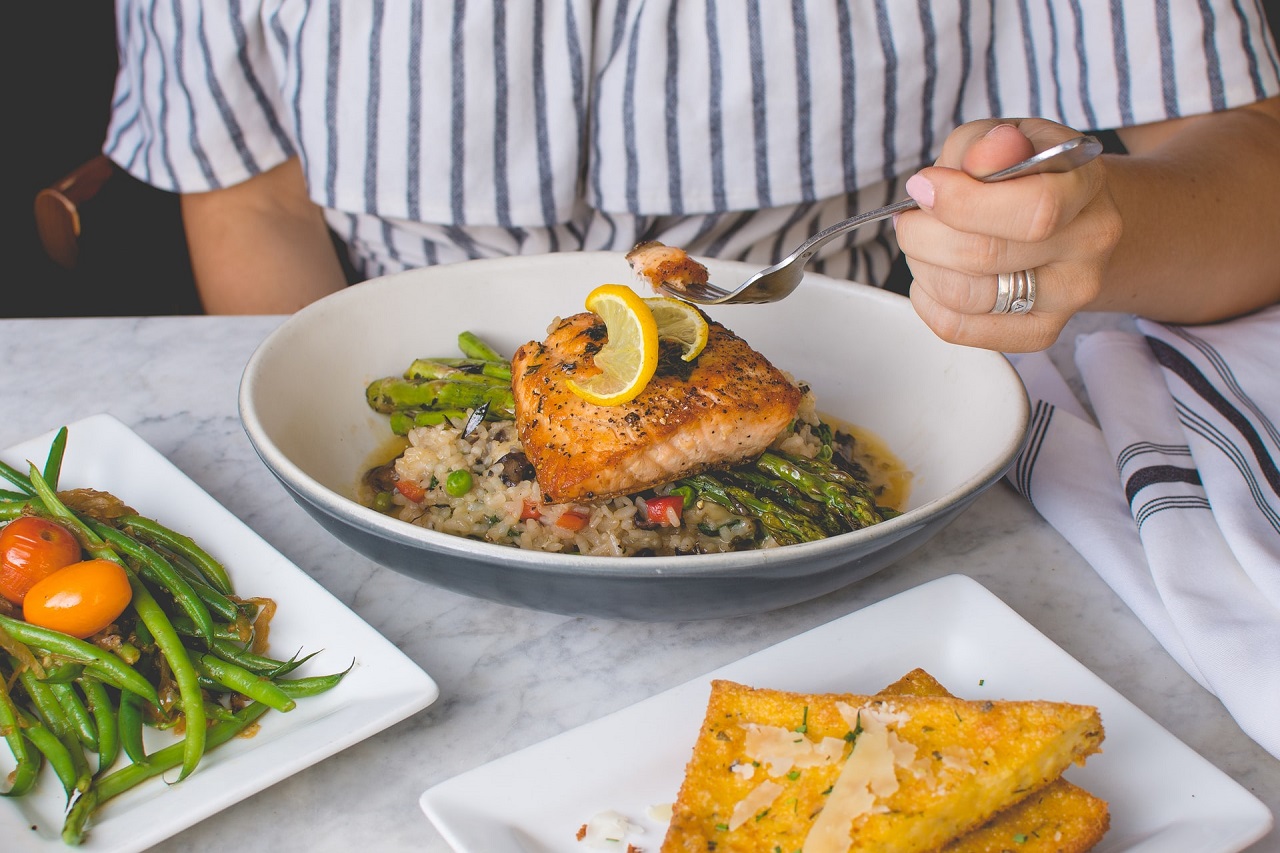 A woman on a Galveston diet eating healthy food